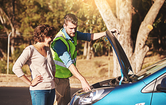 Presidian Warranty - Photo of two people looking at car’s engine